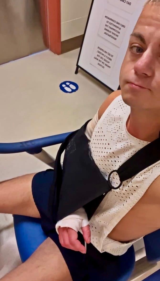 Damon in a wheelchair after elbow surgery in Vancouver