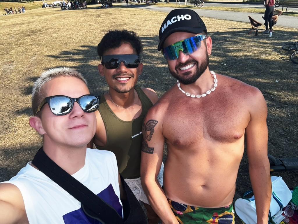 Damon, DJ Thalles and Joshua taking a selfie on the beach